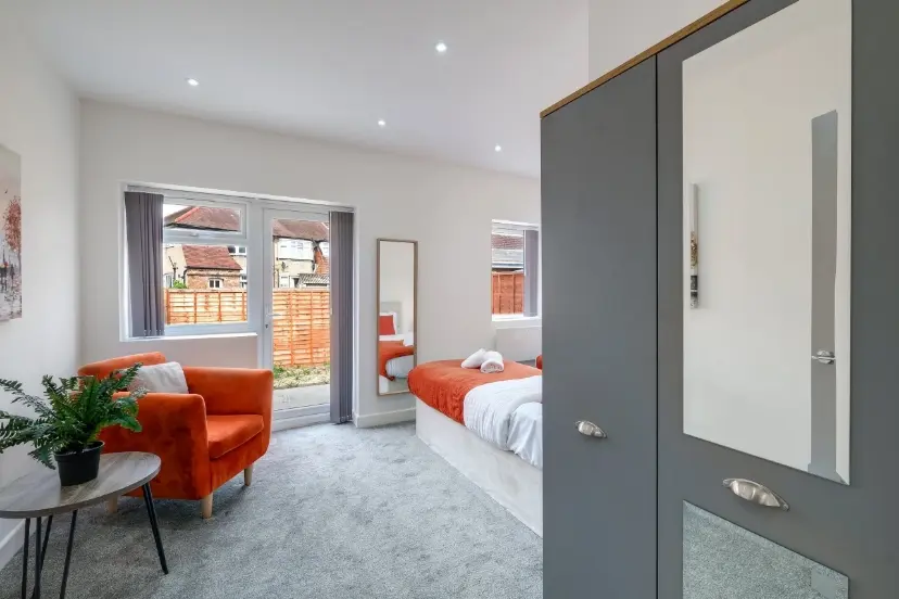 Bedroom with orange armchair